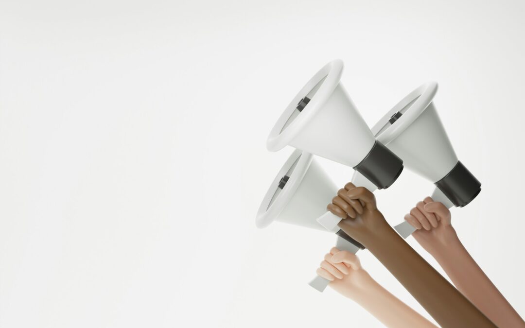 hands holding up megaphones